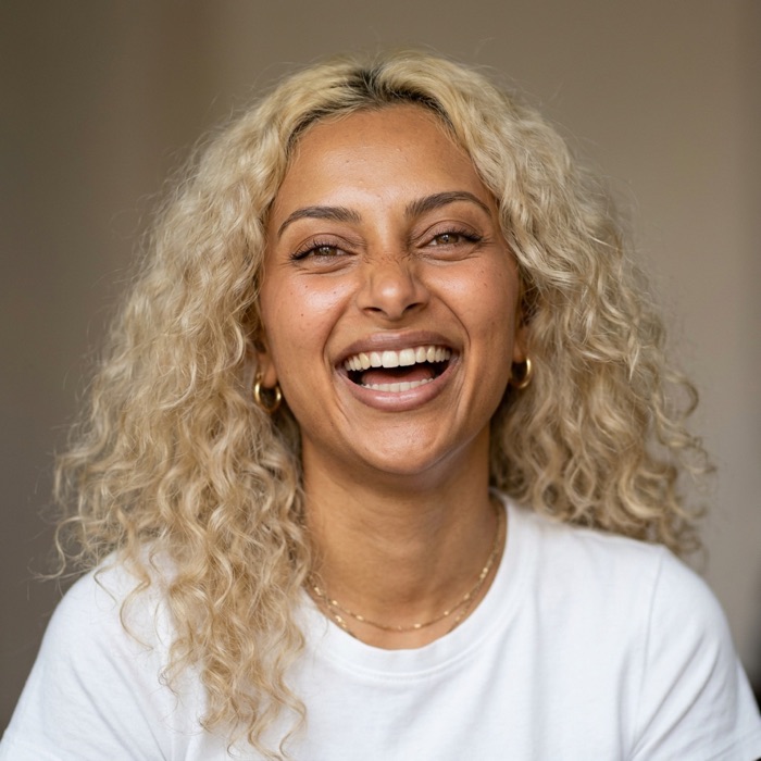 The same AI influencer laughing.